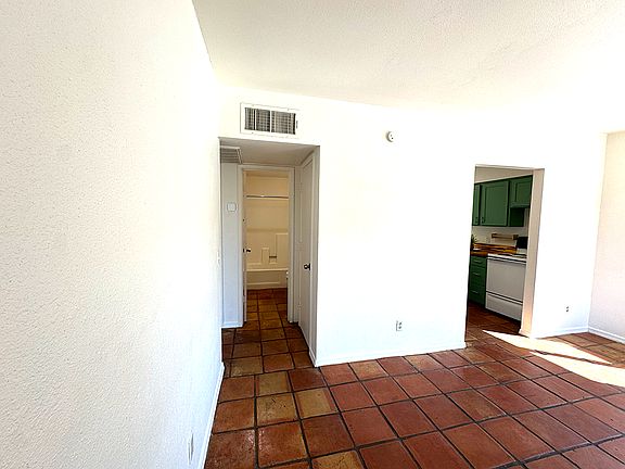 Looking into the hallway & bathroom