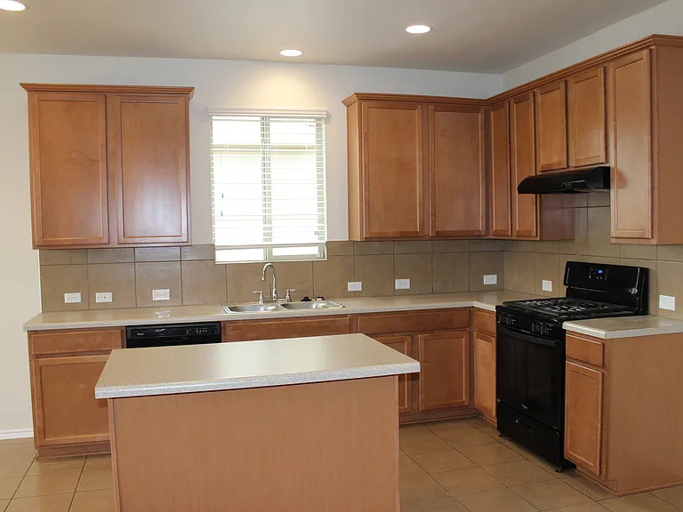 Kitchen from living area/main bedroom