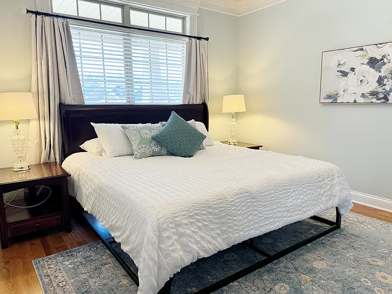 Bedside lamps and plenty of pillows.