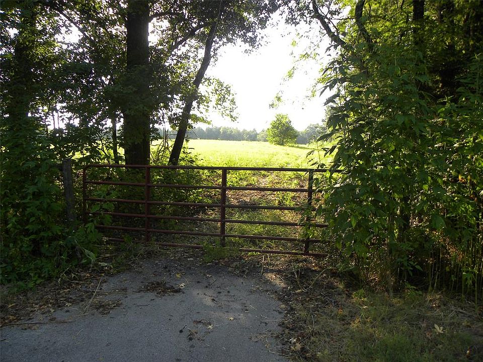 The Entrance into the property off Fm 149. The 5 acres is basically cleared. The 13.8 acres is fenced inside the 5 acres. Come take a peak at this beautiful piece of property!