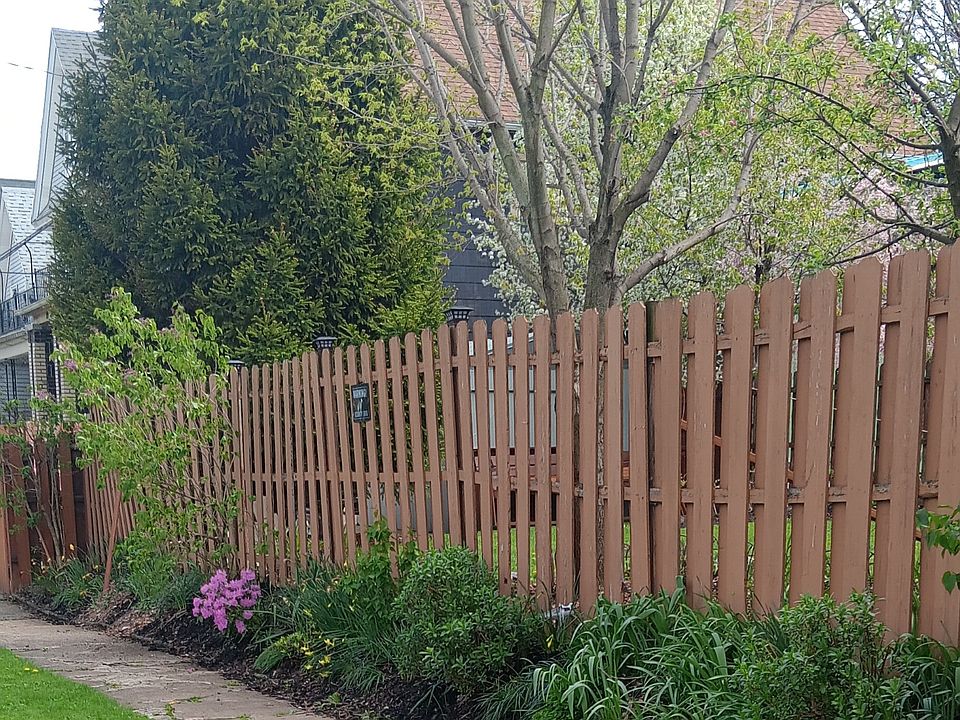 Side yard view, house beyond the trees.