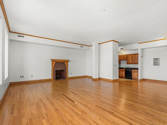 Faux fireplace in living room with Downtown views!
