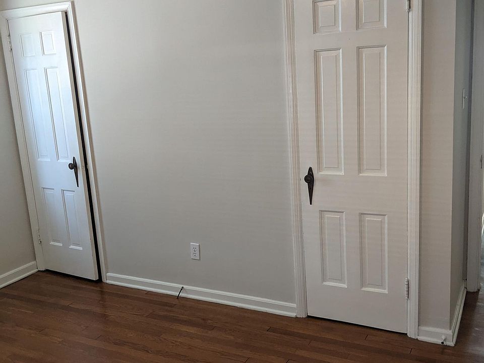 Master bedroom with two closets and nice hardwood floors