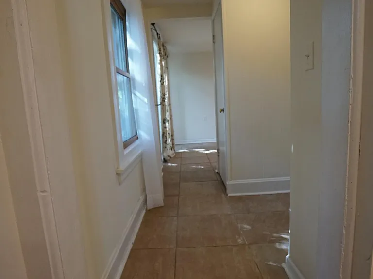 Hallway to first floor bathroom and kitchen