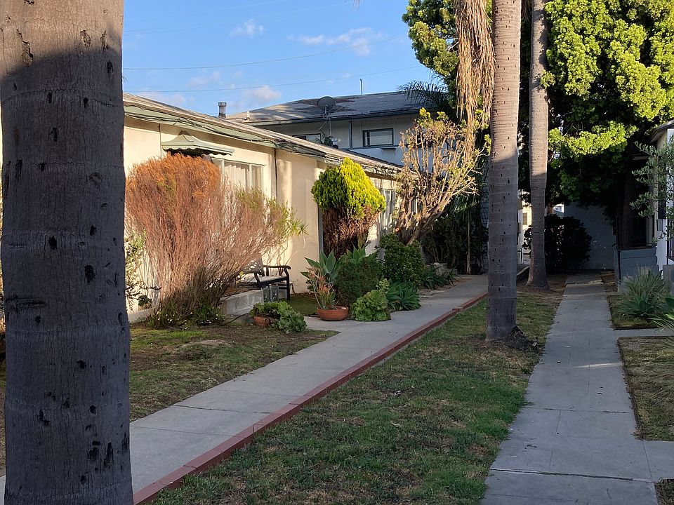 The stairway up to Apt. E. is at the end of the walkway on the left.