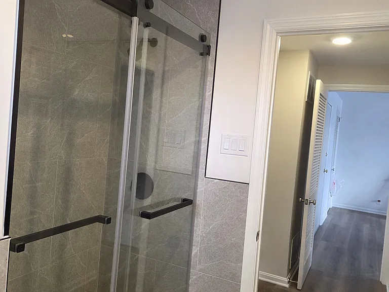 Sliding glass door shower.