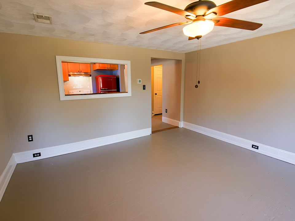 Pulled back view of the Kitchen pass through from the Living Room.