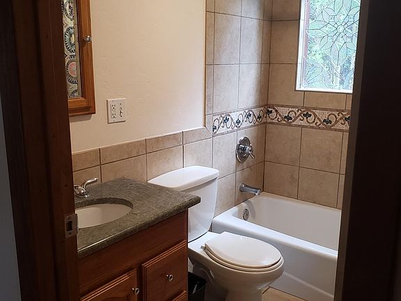 Downstairs full bath and shower with heated tile flooring