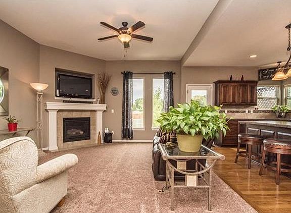 Carpeted living room and hardwood floors in kitchen and dining area.  Very open floor plan and tons of natural light make this a peaceful and calm setting.