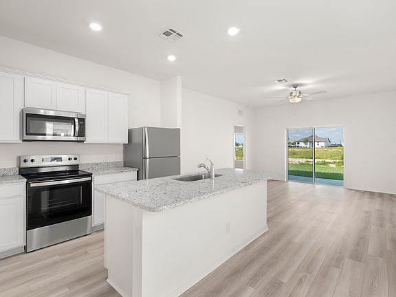 The spacious kitchen is perfect for preparing your family s favorite meals and treats.