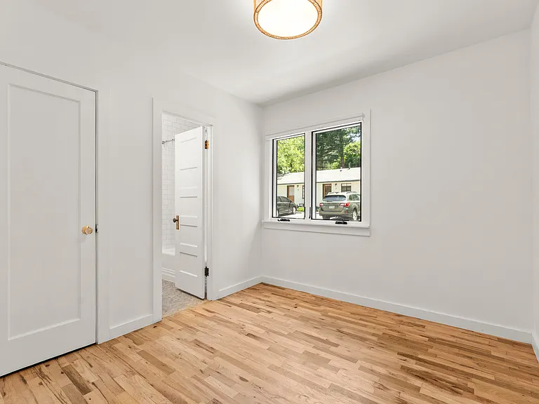Bedroom space has two closets and attached full bath