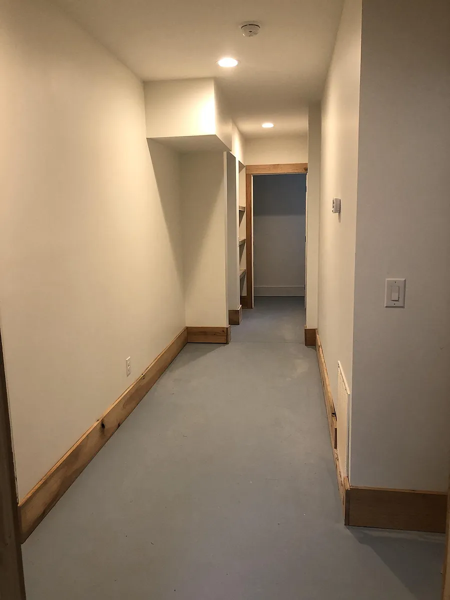 The hallway leads to a double vanity bathroom with ample storage and a tub plus shower. On the left is a bedroom with double closet. - 92 Ridgeway St