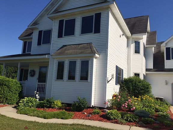 Summer view showing the gorgeous landscaping
