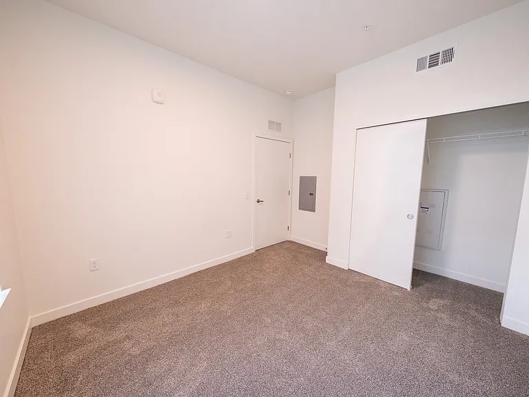 One Bedroom - Primary bedroom with view of closet space