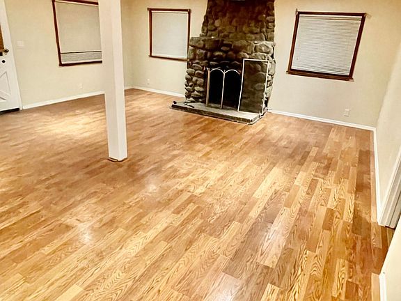 Open Living Room with Wood Burning Fireplace