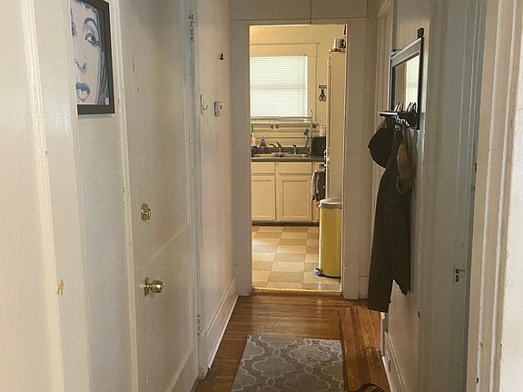 View from living room, kitchen in front, bathroom and bedroom on the right