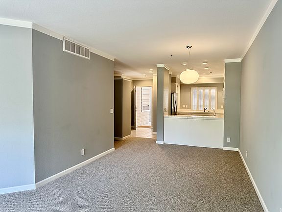 View from Living Room to Dining Room, Kitchen and Entry