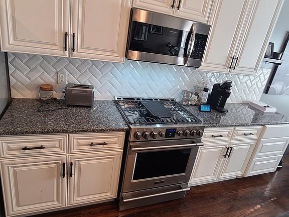 New stainless steel appliances ALL FRIDIDARE, 6 burner gas stove, side by side refrigerator and overhead microwave. Stainless steel dishwasher by BAUSCH. It is the quietest dishwasher on the market. New sink, new faucet, new garbage disposal.