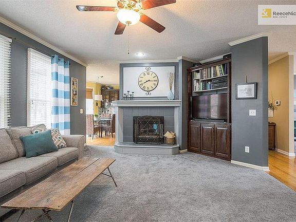 Double-sided fireplace and bright natural light! New carpet too!