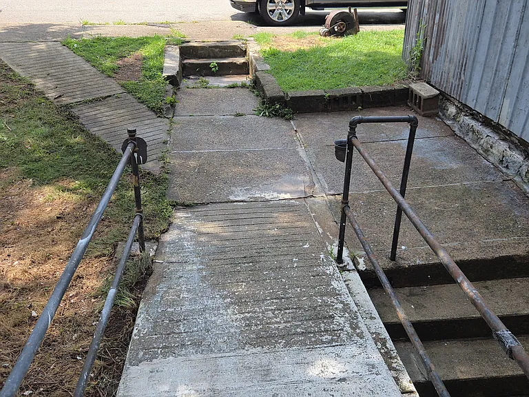 Sidewalk out the back door for unit 1