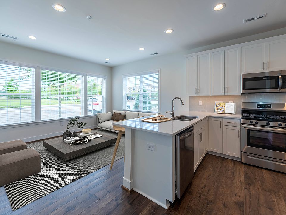 D1 Exterior Lower Level Home Virtually Staged Living Room and Kitchen