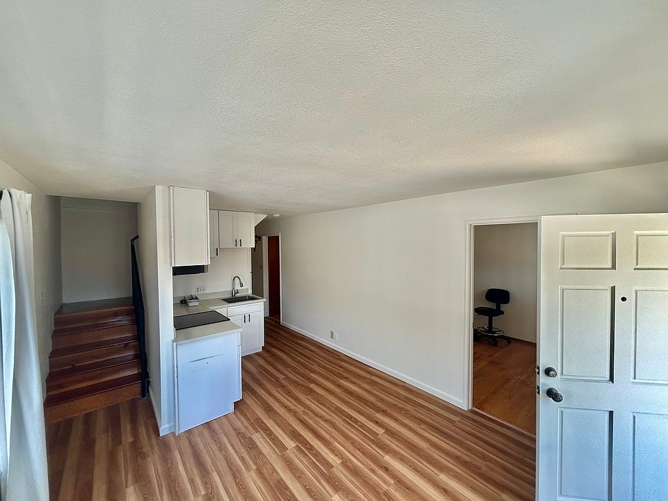 Main Livingroom with view of kitchen and 1st bedroom