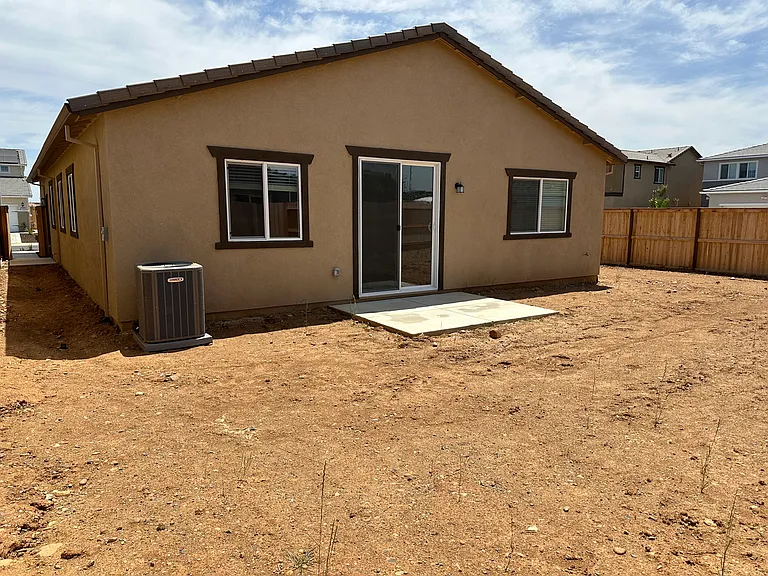 Sprawling Backyard: will be paved soon