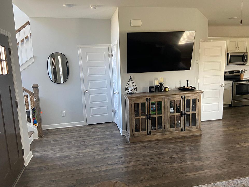 Front door, half bath, coat closet, TV