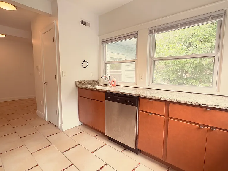 Kitchen with Stainless Steel Appliances and Modern Light Fixture