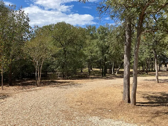Front grounds including circular driveway