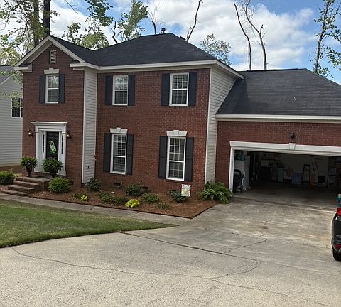 Driveway view with garage