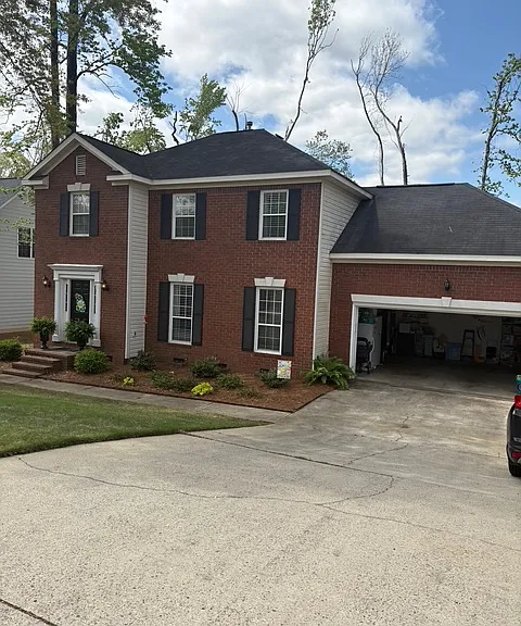 Driveway view with garage
