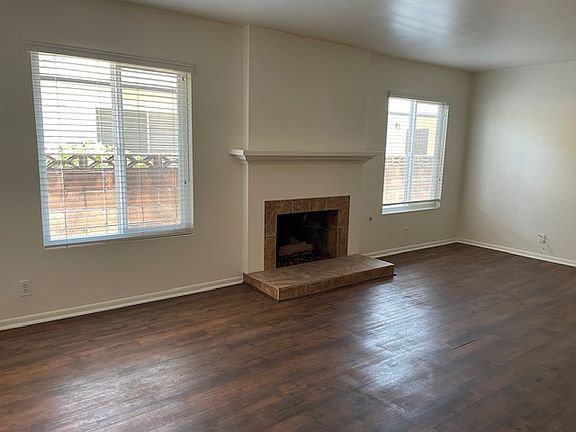 Large, airy living room with gas fireplace