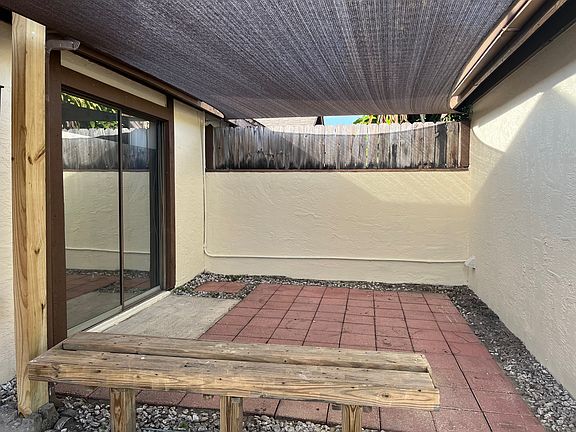 Private covered patio off the between the front of the duplex & the free standing garage.