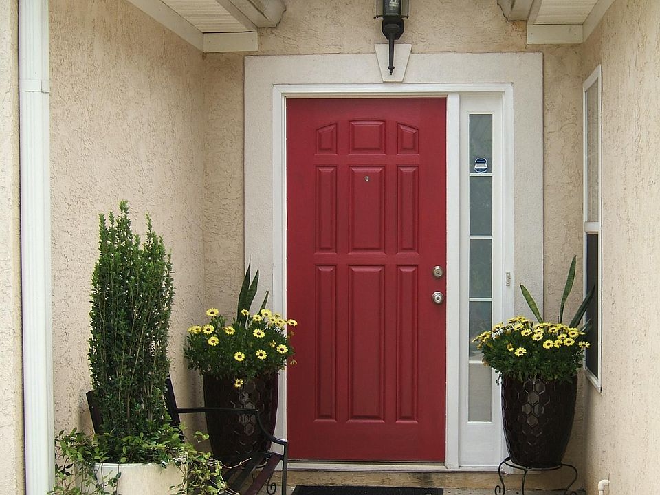 Beautiful Front Entry Way with bench and large flower pots