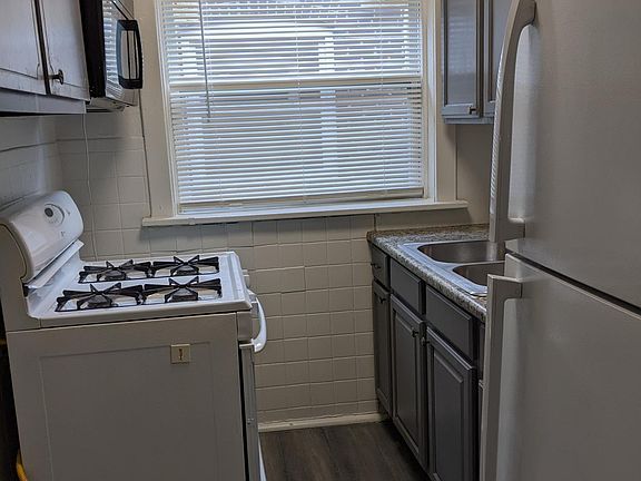 Kitchen with Gas Stove,owav Refrigerator and Microwave