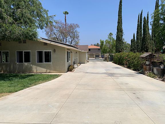Parking behind gate on side of house.
