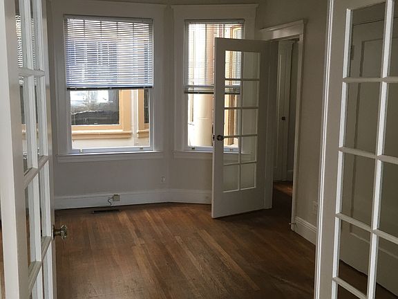 French doors to Bedroom (or LivingRm); far doorway to kitchen.