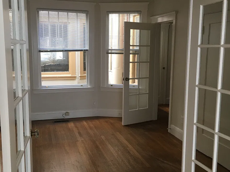 French doors to Bedroom (or LivingRm); far doorway to kitchen.