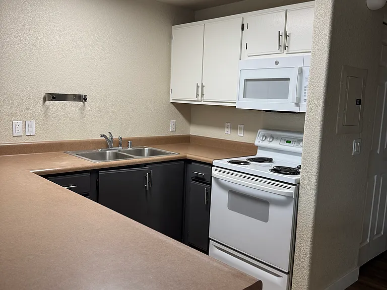 Updated kitchen with breakfast bar and full appliance package, freshly painted