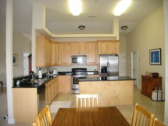 Kitchen boasts granite countertops, stainless appliances, beautiful cabinetry,