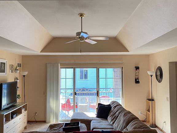 View of living room and private balcony from kitchen.