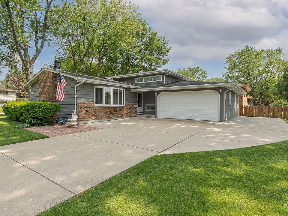 This brick and cedar beauty lives large with 4-5 bedrooms, 2.1 baths and a large eat-in kitchen. The