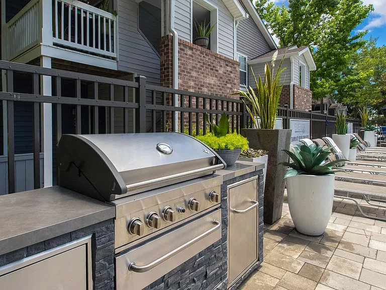 Elevate your poolside experience with al fresco dining and entertaining at our outdoor kitchen.