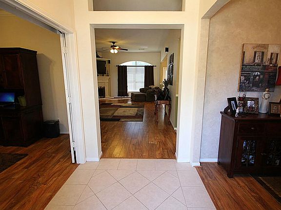 Inviting entrance with formal dining on right and office on left.