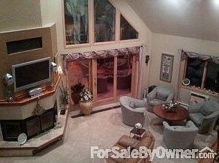 Great room w/ pic of tri-view fireplace