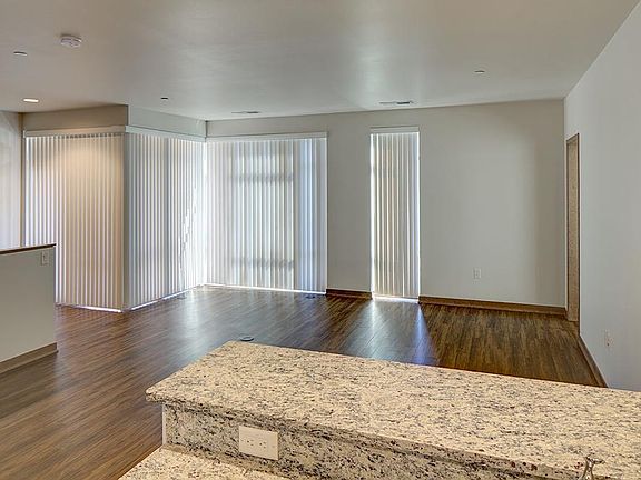 Tons of light from the window wall w/vertical blinds