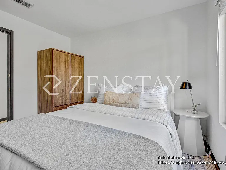 Comfortable bedroom with queen bed and inviting layout