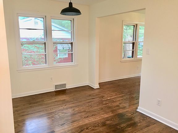 From kitchen looking to dining room and into living room