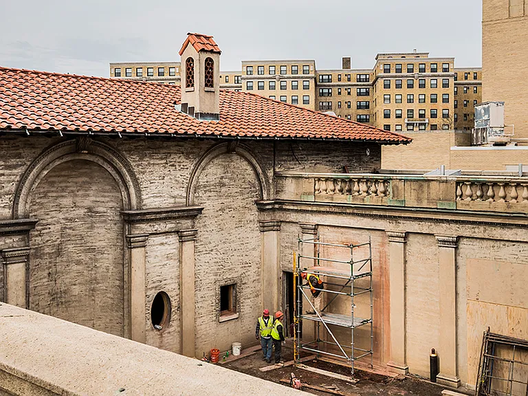 Before: Exterior of building during renovation featuring original architecture
